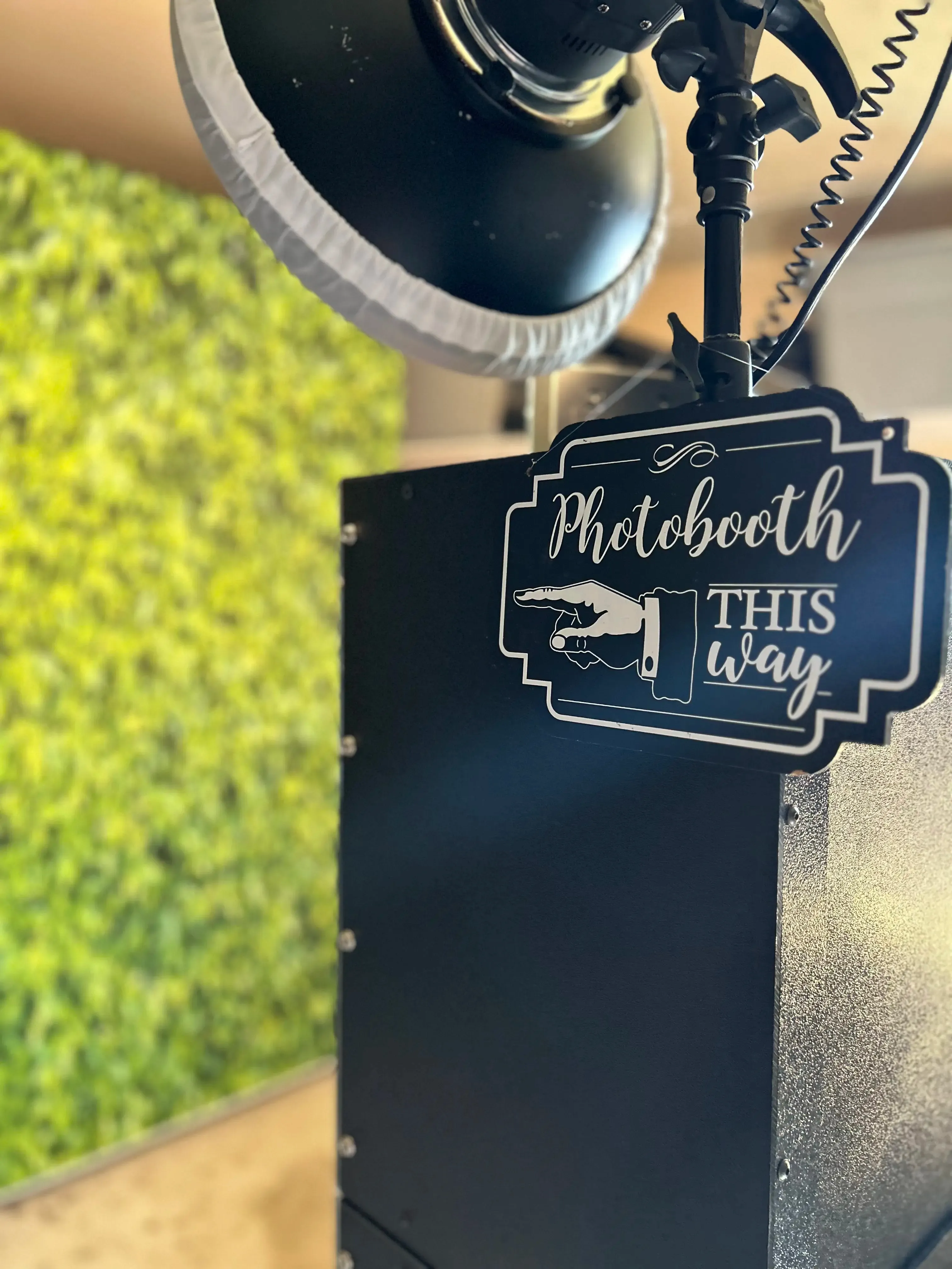 'Photobooth This Way' wayfinding sign directing guests to their fun