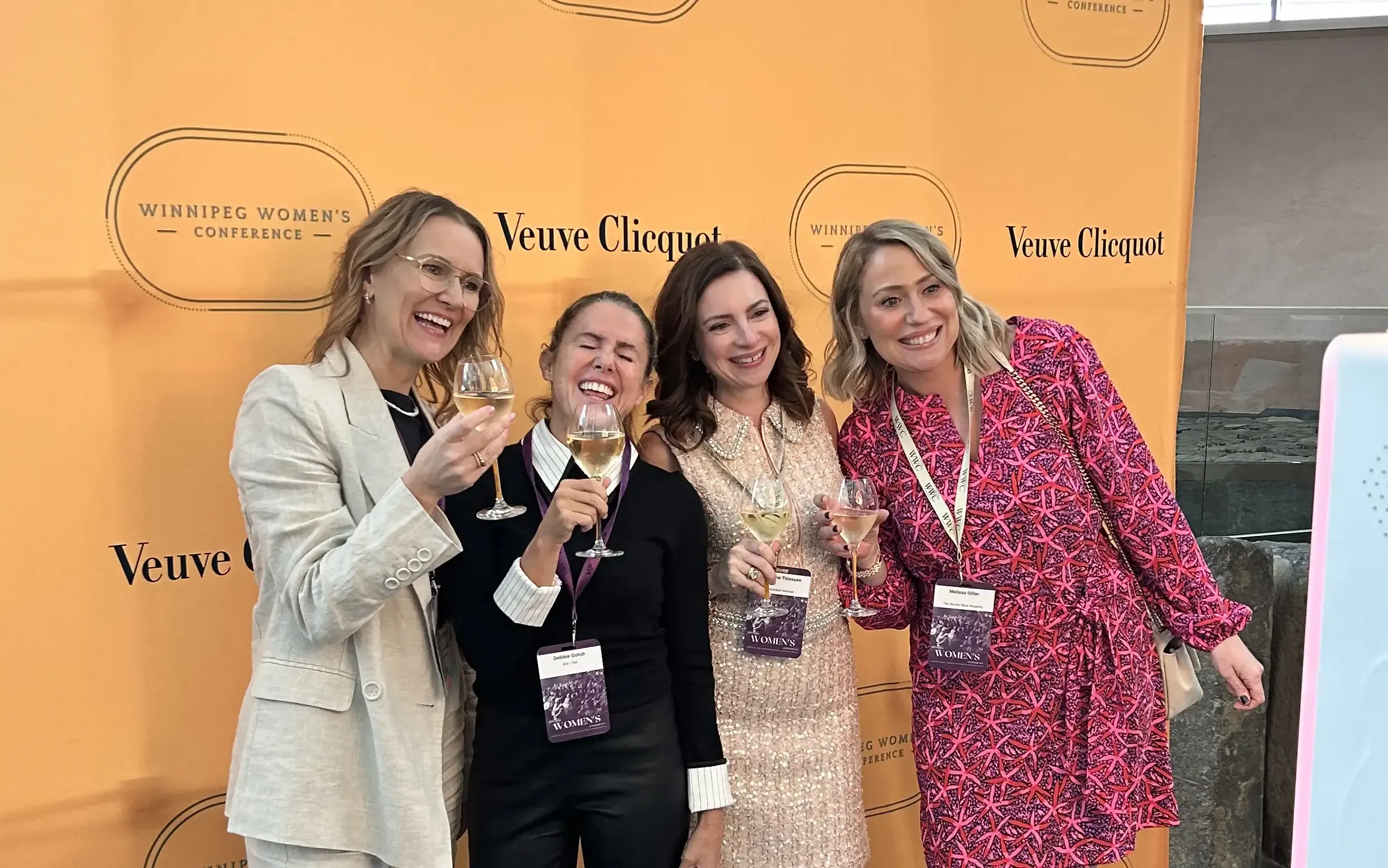 Women toasting with champagne flutes at the Veuve Clicquot Winnipeg Women's Conference